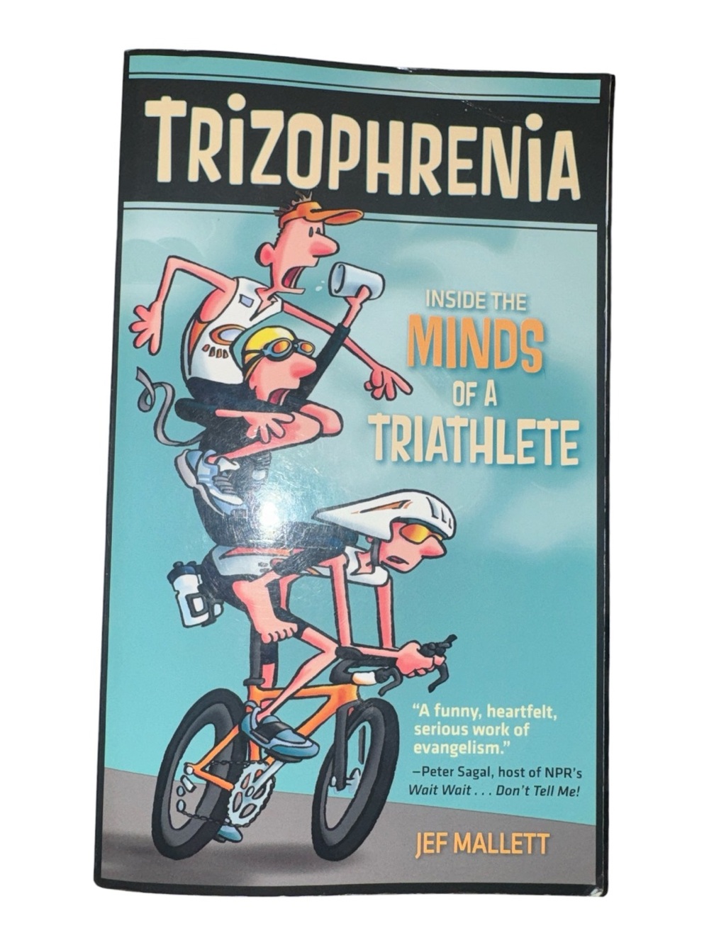 Trizophrenia: Inside the Minds of a Triathlete Light Teal Cover by Jef Mallett